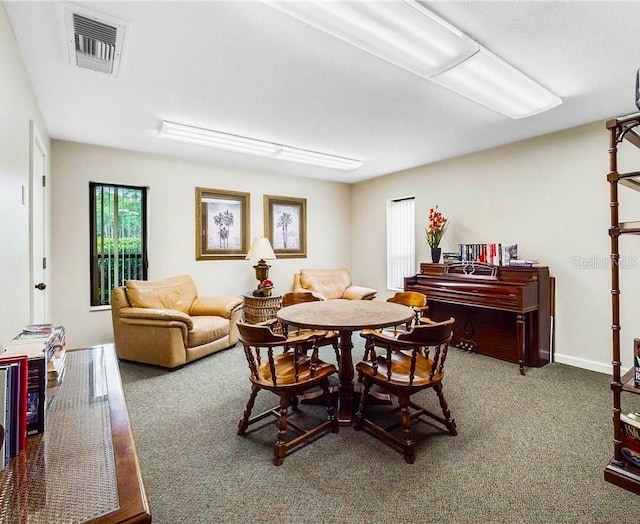 dining room featuring carpet