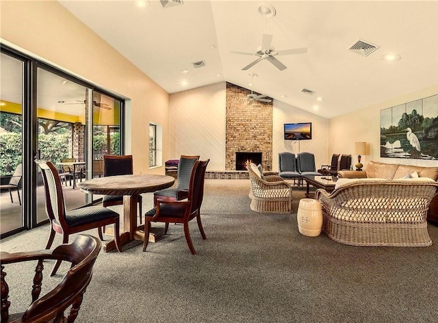 interior space featuring vaulted ceiling, a fireplace, and ceiling fan