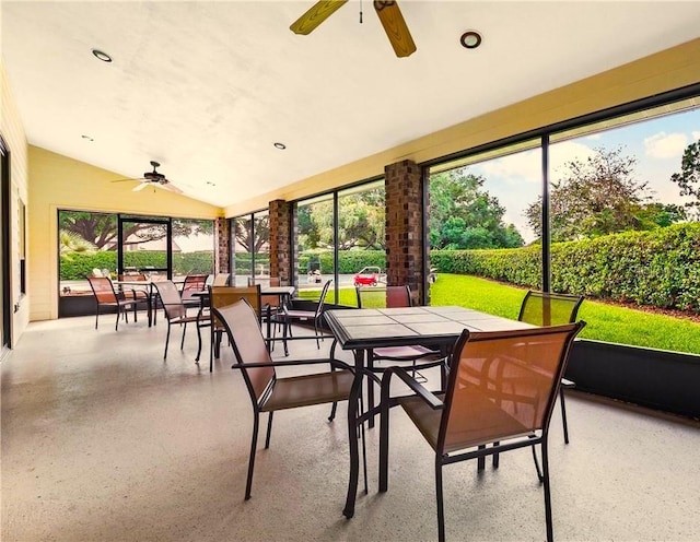 sunroom with vaulted ceiling and ceiling fan