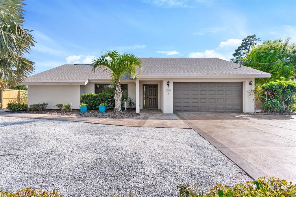 single story home featuring a garage