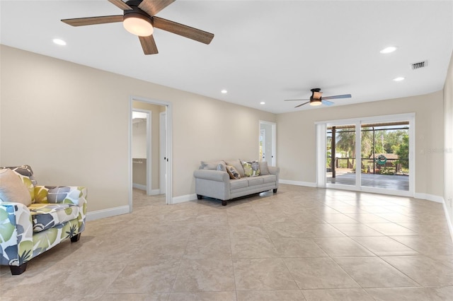 living room featuring light tile patterned floors and ceiling fan