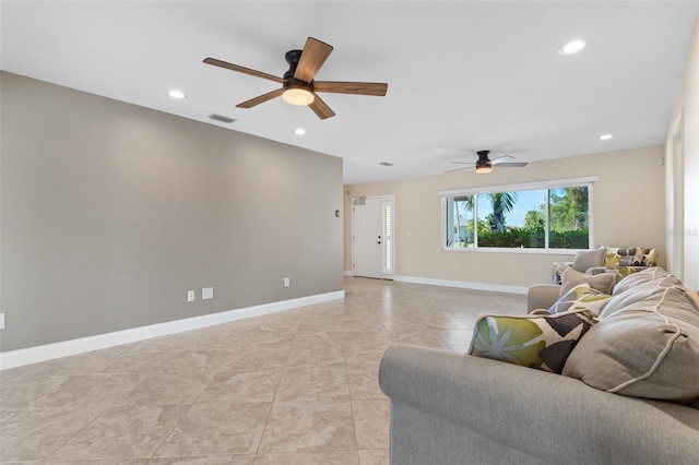 living room featuring ceiling fan and light tile patterned flooring