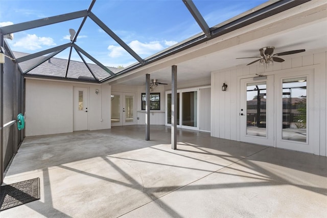 view of patio featuring french doors, a lanai, and ceiling fan