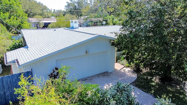 view of side of property with a garage