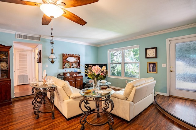 living room with crown molding, dark hardwood / wood-style floors, and ceiling fan