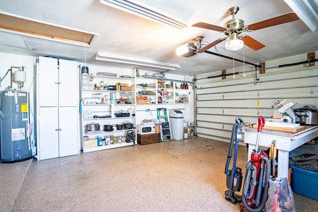 garage featuring a garage door opener, ceiling fan, and electric water heater