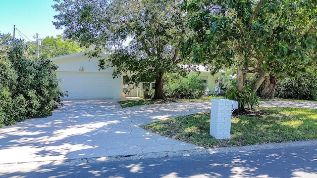 obstructed view of property featuring a garage