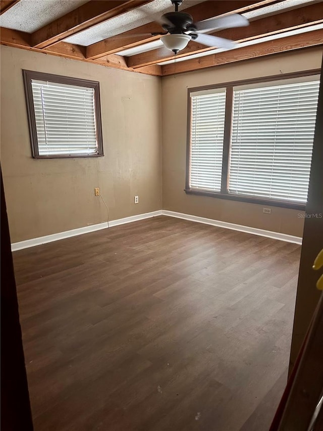 unfurnished room featuring ceiling fan, beam ceiling, and hardwood / wood-style floors