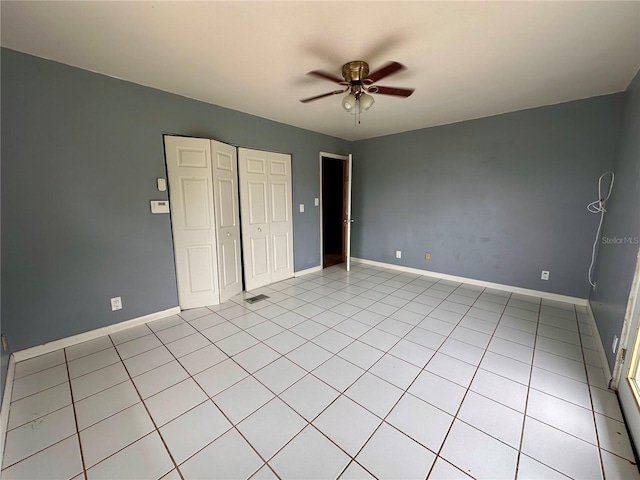 unfurnished bedroom featuring ceiling fan