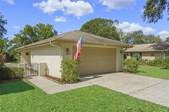 view of front of home featuring a front yard and a garage