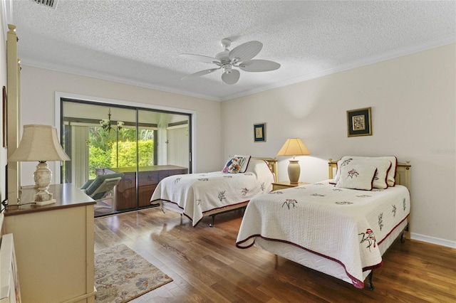 bedroom with ceiling fan, wood-type flooring, a textured ceiling, and ornamental molding