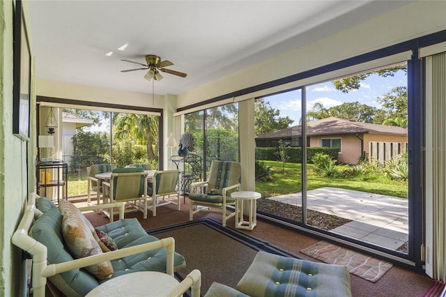 sunroom with ceiling fan and a wealth of natural light