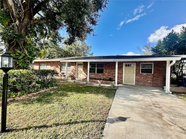 ranch-style home with a porch and a front yard