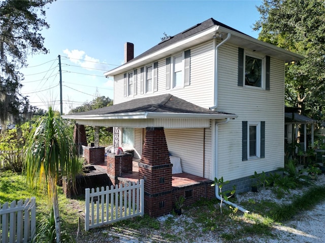 rear view of property featuring a patio