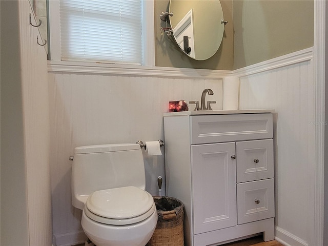 bathroom with toilet and vanity