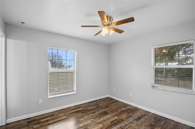 unfurnished room with dark hardwood / wood-style floors, a textured ceiling, and ceiling fan