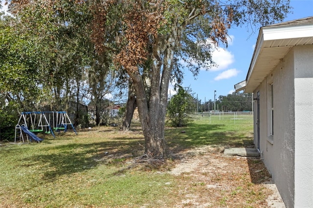 view of yard with a playground