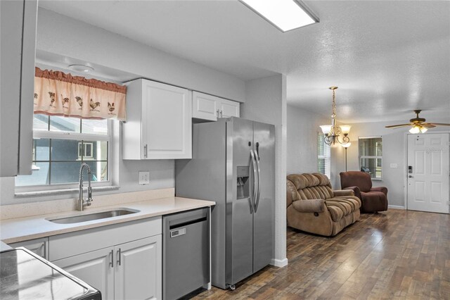 kitchen featuring stainless steel appliances, sink, white cabinets, and dark hardwood / wood-style floors