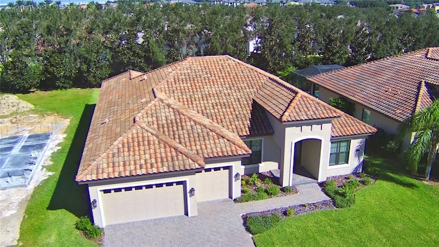 exterior space with a front lawn and a garage