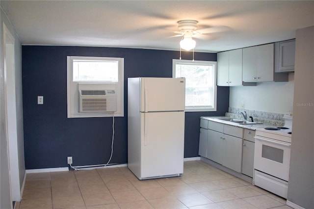 kitchen featuring cooling unit, sink, light tile patterned flooring, white appliances, and ceiling fan