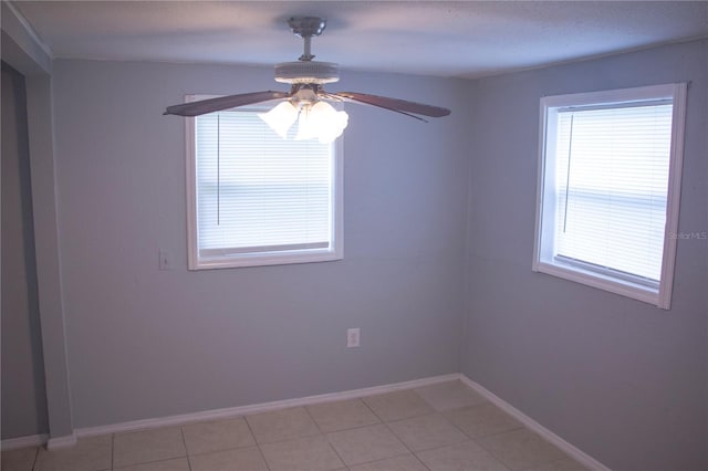 tiled empty room with ceiling fan