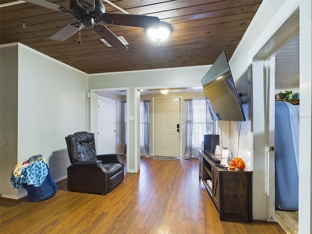 sitting room with crown molding, ceiling fan, hardwood / wood-style flooring, and wooden ceiling