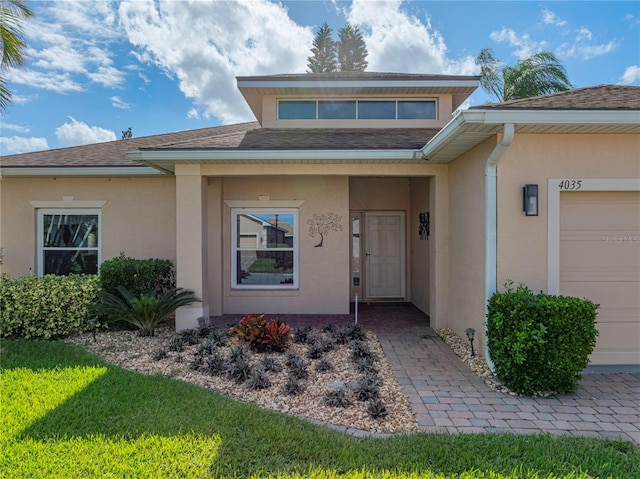 doorway to property featuring a garage