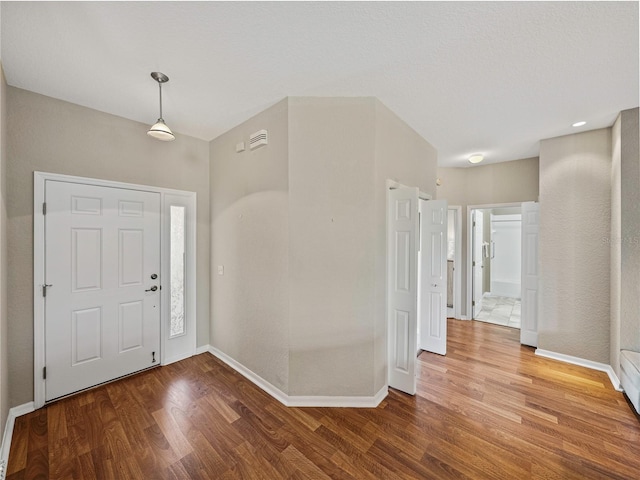 foyer entrance featuring hardwood / wood-style floors