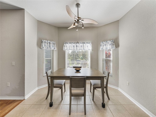 dining room with ceiling fan and light tile patterned floors