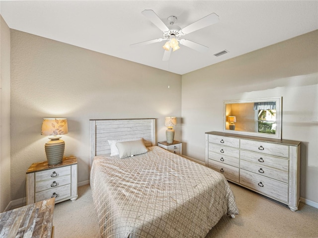 bedroom featuring light carpet and ceiling fan