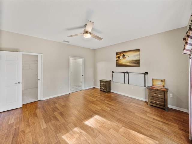 unfurnished living room with ceiling fan and light hardwood / wood-style flooring