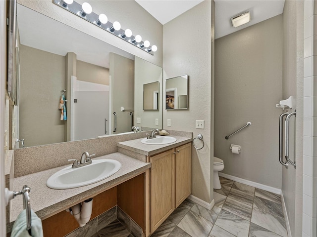 bathroom with toilet and vanity