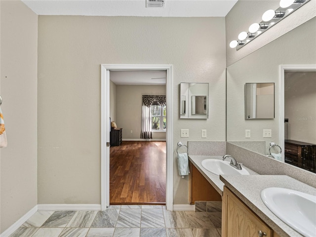 bathroom with wood-type flooring and vanity