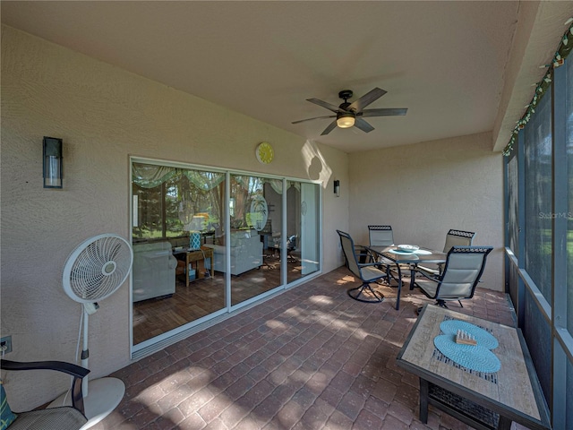 sunroom / solarium with ceiling fan