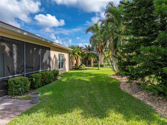 view of yard featuring a sunroom