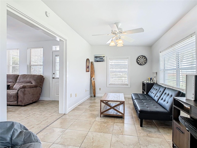 living room featuring light tile patterned flooring and ceiling fan