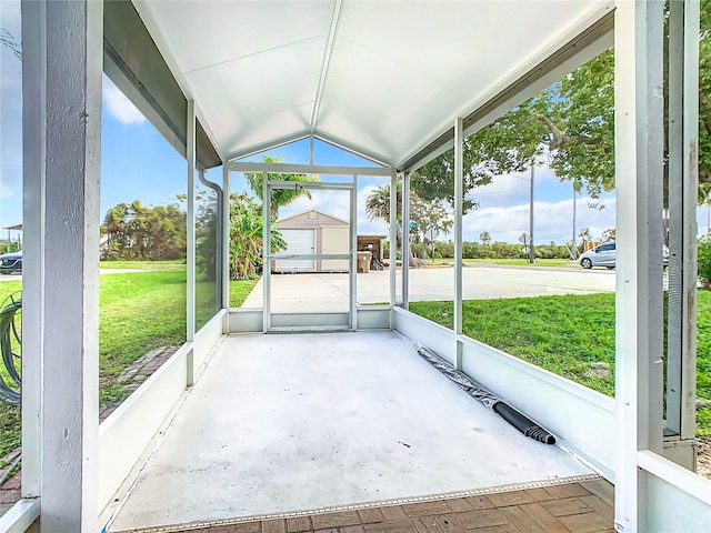 unfurnished sunroom with vaulted ceiling