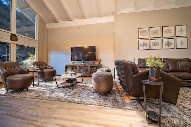 living room with high vaulted ceiling, beamed ceiling, and wood-type flooring