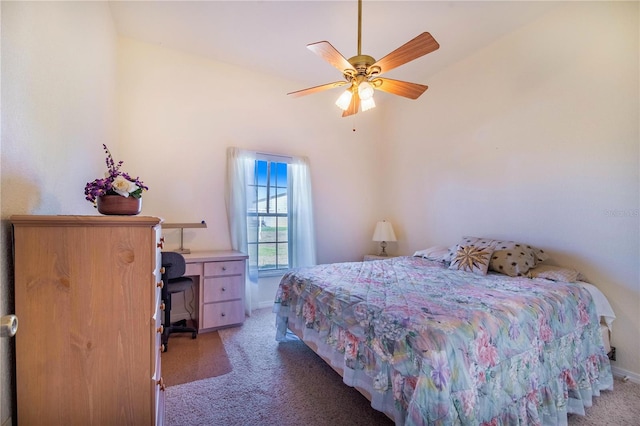 carpeted bedroom with lofted ceiling and ceiling fan