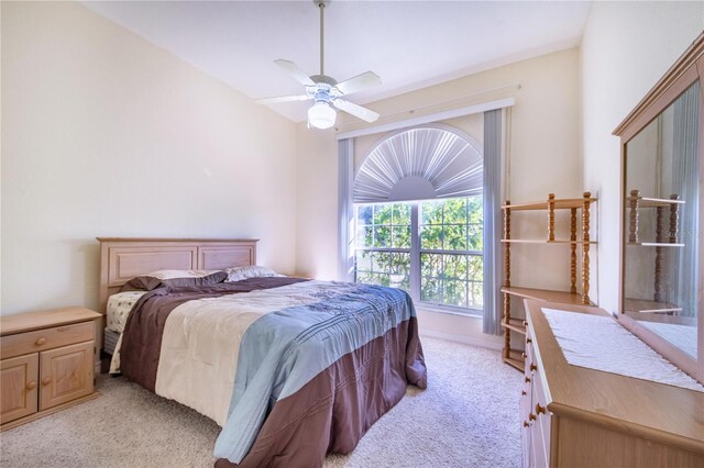 bedroom with light colored carpet and ceiling fan