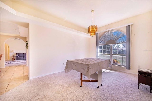 playroom with a notable chandelier and light colored carpet