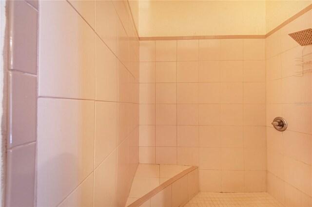 bathroom with a tile shower