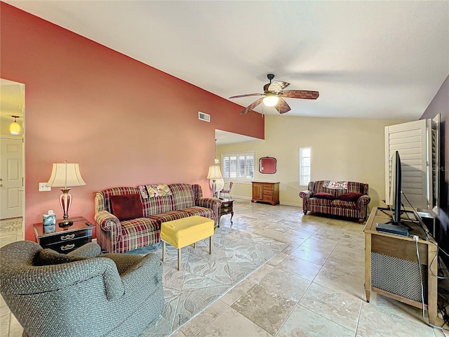 living room with ceiling fan and vaulted ceiling