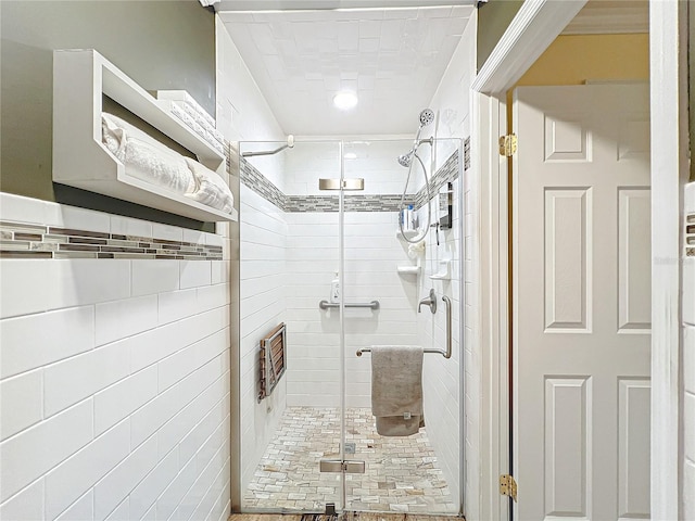 bathroom with a shower with shower door