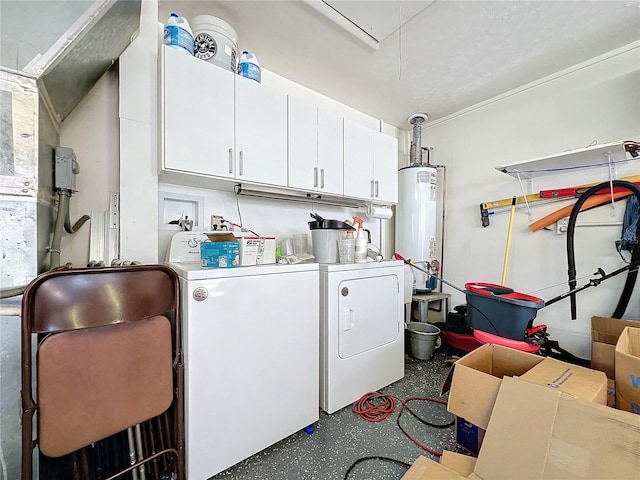 laundry area featuring gas water heater, washing machine and clothes dryer, and cabinets