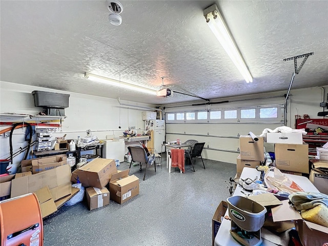 garage with a garage door opener and white refrigerator