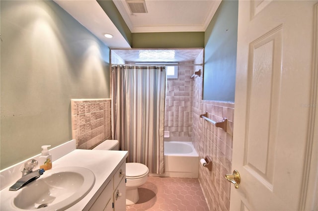 full bathroom with tile patterned flooring, crown molding, tile walls, and shower / bathtub combination with curtain