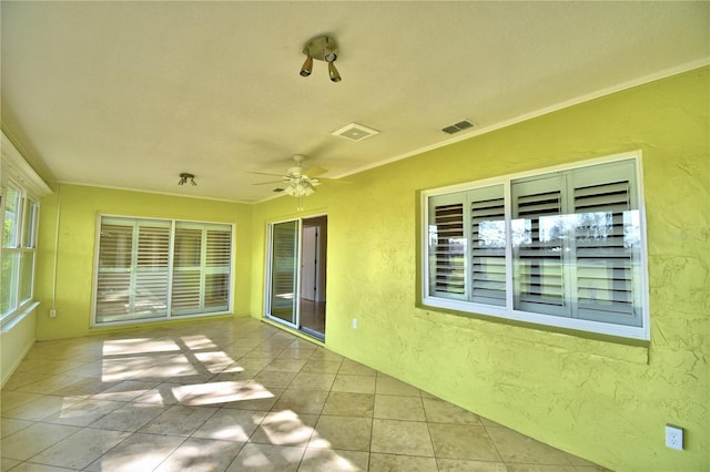 exterior space featuring ceiling fan