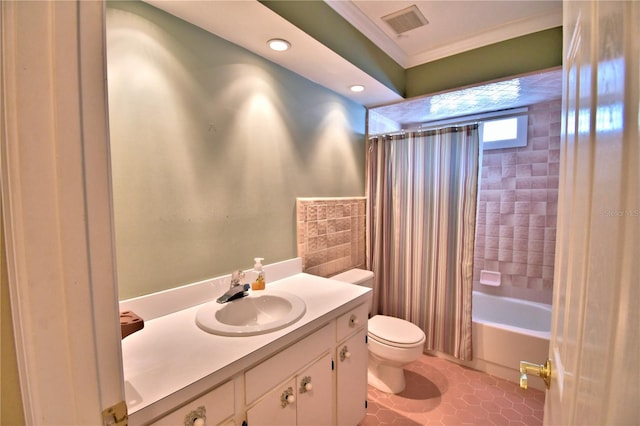 full bathroom with crown molding, vanity, tile patterned floors, toilet, and shower / bath combo with shower curtain