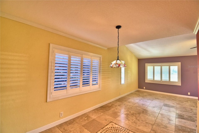 unfurnished dining area with vaulted ceiling